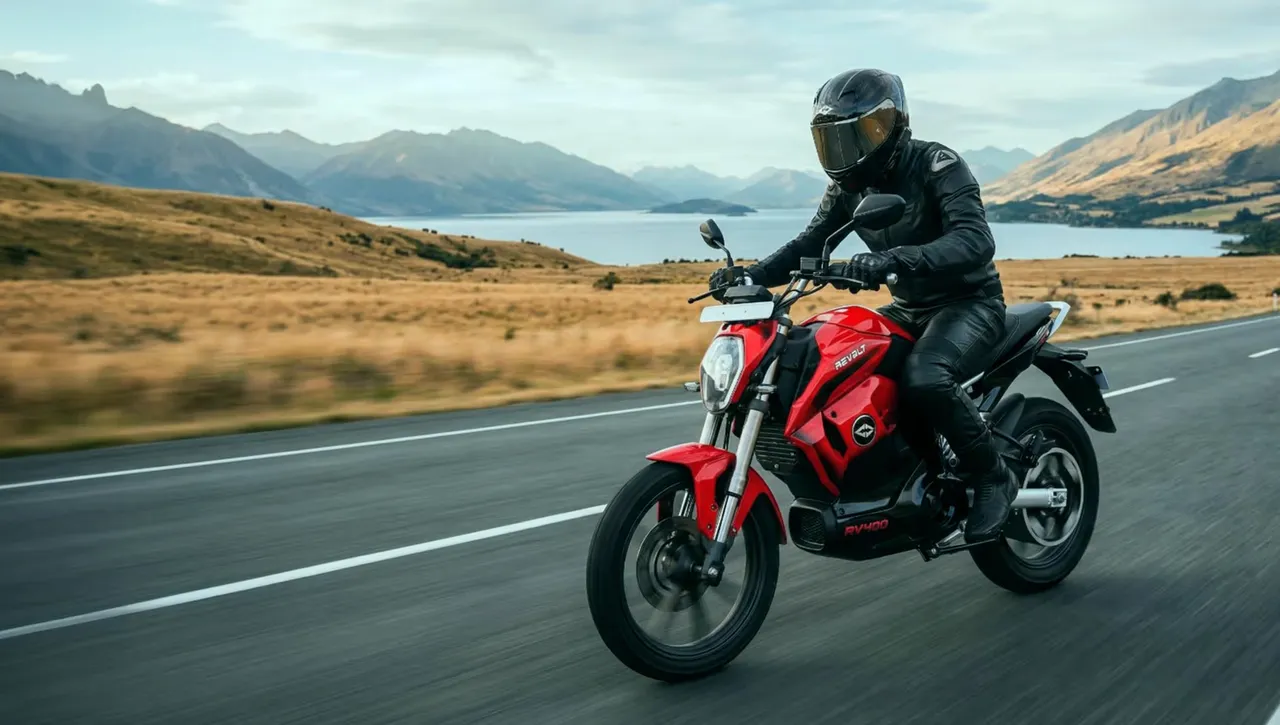 A rider on a red Revolt electric motorcycle
